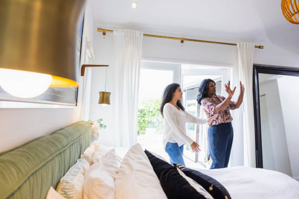 mother and daughter viewing home during open house - home decoration stock pictures, royalty-free photos & images
