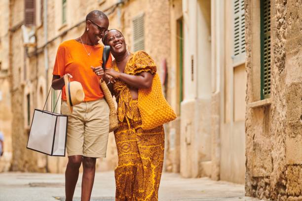 mother and daughter walking together on vacation. - travel stock pictures, royalty-free photos & images