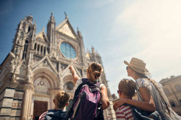 mother and kids sightseeing city of siena, tuscany, italy - travel stock pictures, royalty-free photos & images