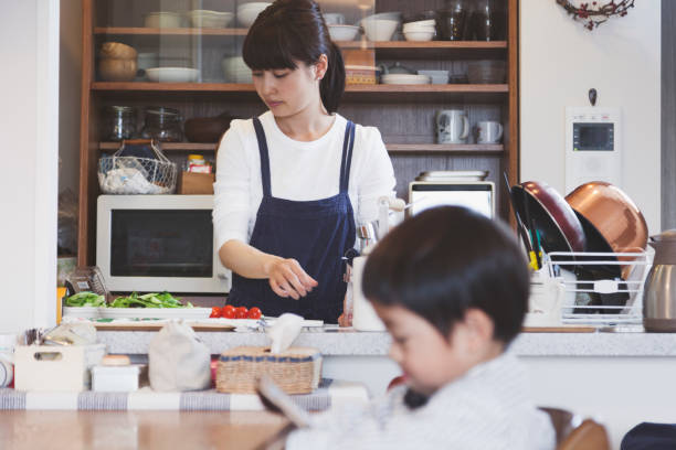 mother and son in the dining kitchen at home - food stock pictures, royalty-free photos & images