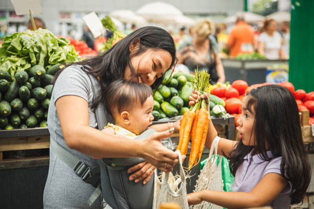 mother with kids shopping in market - food stock pictures, royalty-free photos & images