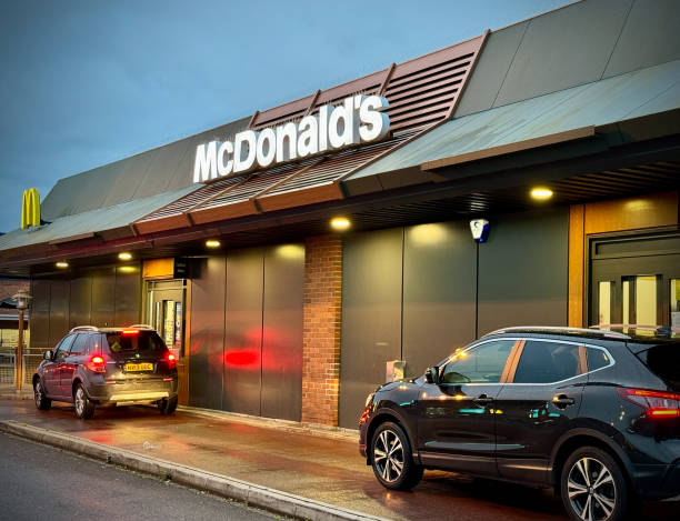 Motorists queue to use the Drive Thru hatch of the fast food restaurant McDonald's, on October 18, 2023 in Bristol, England. Founded in 1940,...