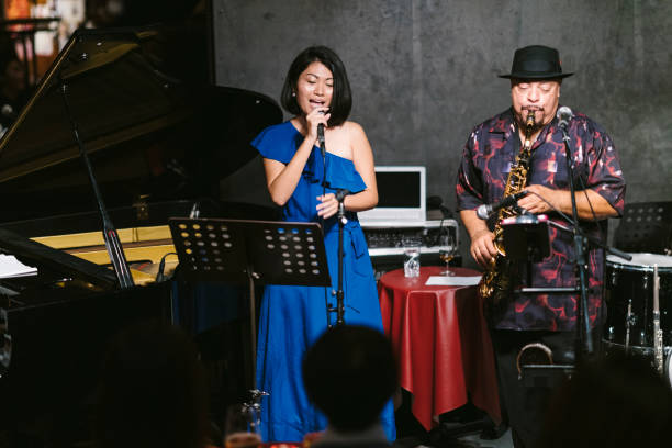 multi-ethnic jazz music group performing at stage - concert stock pictures, royalty-free photos & images