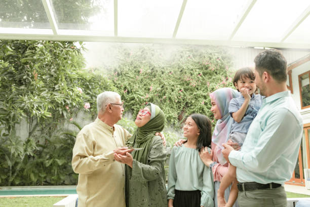 multi-generation family enjoying celebrating birthday - garden decoration stock pictures, royalty-free photos & images