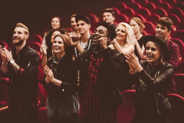 multiracial group of people in the movie theater - concert stock pictures, royalty-free photos & images
