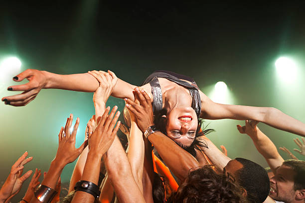music performer crowd surfing - concert stock pictures, royalty-free photos & images