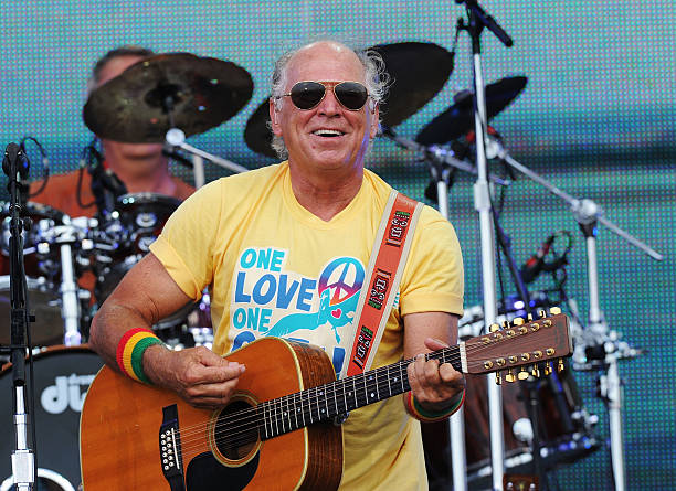 Musician Jimmy Buffett performs onstage at Jimmy Buffett & Friends: Live from the Gulf Coast, a concert presented by CMT at on the beach on July 11,...