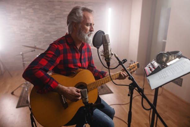 musician recording a new song in the studio - concert stock pictures, royalty-free photos & images