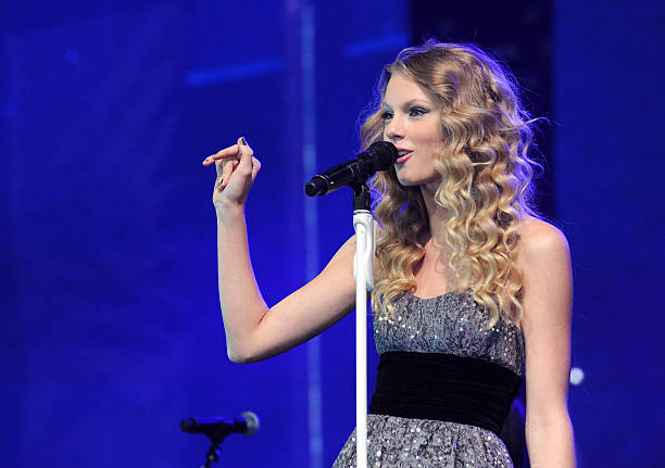 Musician Taylor Swift performs onstage at the "We're All For The Hall" benefit concert for the Country Music Hall of Fame at the Sommet Center on...