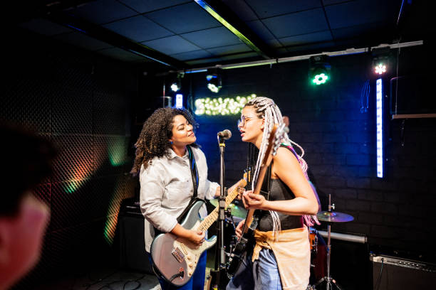 musicians playing and singing on a show - concert stock pictures, royalty-free photos & images