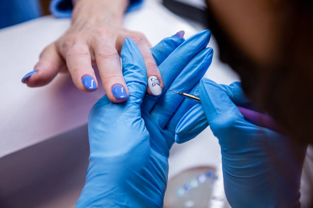 nail technician doing nail art at her home nail salon - nails art stock pictures, royalty-free photos & images