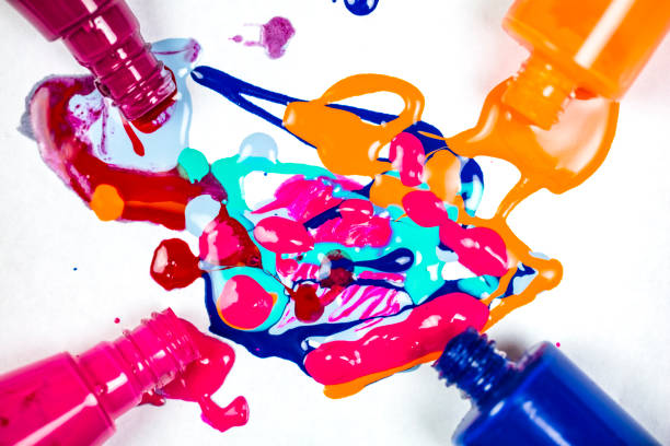 nail varnish spilling onto white background. abstract background - nails art stock pictures, royalty-free photos & images