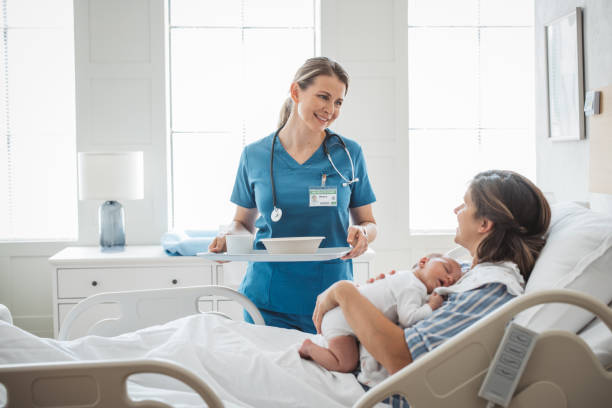 new born baby with his mother at hospital - food stockfoto's en -beelden