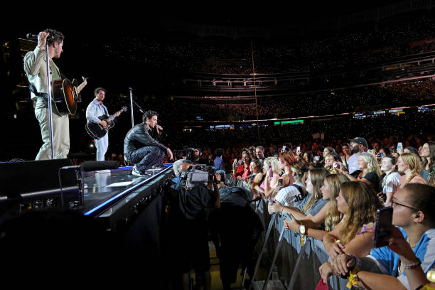Nick Jonas, Joe Jonas, and Kevin Jonas perform onstage during Jonas Brothers “Five Albums, One Night” Tour - New York at Yankee Stadium on August 13,...