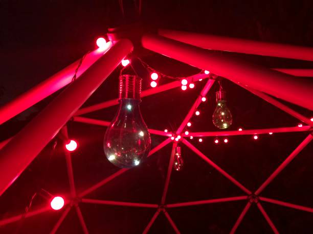 night cinematic geodesic dome with red neon light at garden - garden decoration stock pictures, royalty-free photos & images
