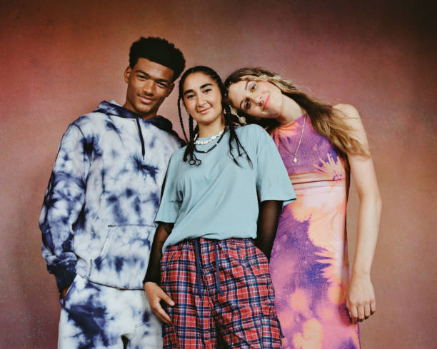 non-binary person with male and female friends - hairstyle stock pictures, royalty-free photos & images