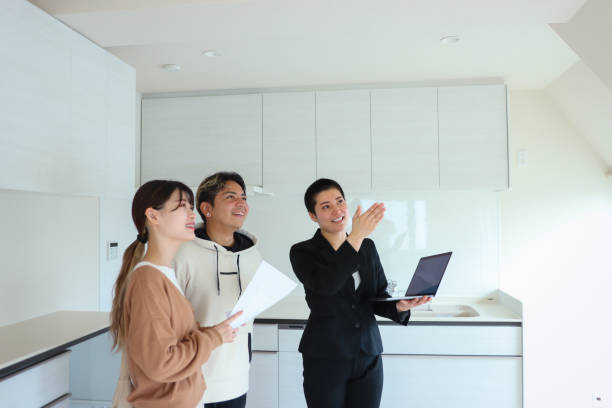 non-binary real estate agent and multi-ethnic young couple visit to new house - home decoration stock pictures, royalty-free photos & images