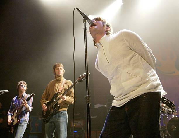 Oasis guitarist Gem Archer, bassist Andy Bell and singer Liam Gallagher perform at The Joint inside the Hard Rock Hotel & Casino April 26, 2002 in...