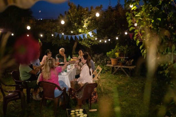 old friends having fun time on birthday party at backyard - garden decoration stock pictures, royalty-free photos & images