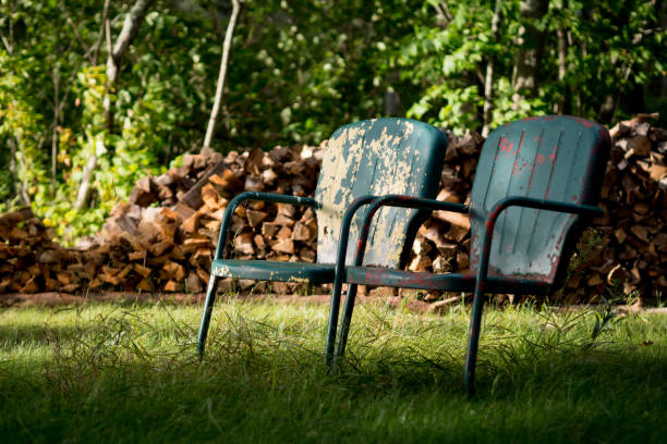 old metal chairs in a yard. - garden decoration stock pictures, royalty-free photos & images