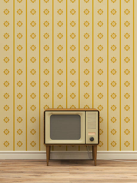 old television in front of yellow patterned wallpaper - home decoration stock illustrations