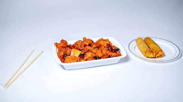 orange chicken deliverables - junk food stock pictures, royalty-free photos & images