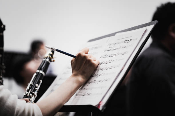 orchestra rehearsing at concert hall - concert stock pictures, royalty-free photos & images