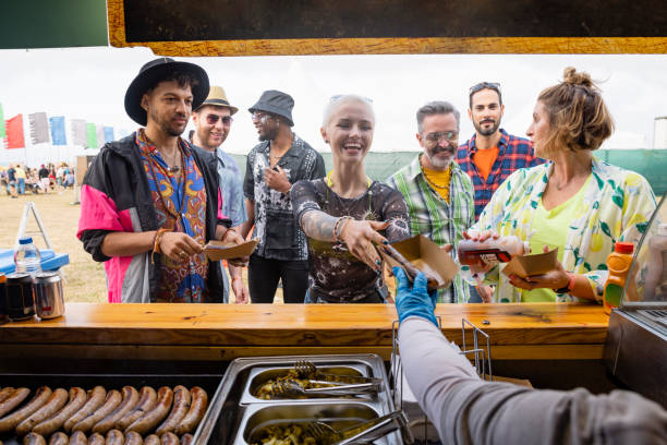 ordering at a food truck - concert stock pictures, royalty-free photos & images