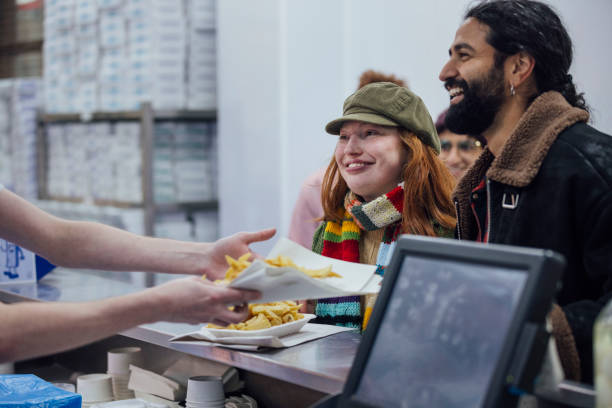 ordering fish and chips - junk food stock pictures, royalty-free photos & images