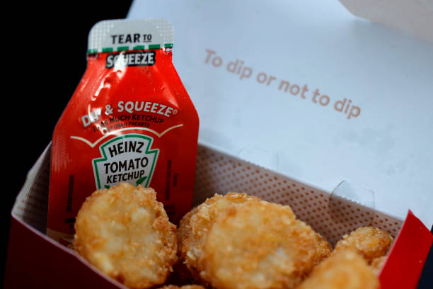 Packet of Heinz ketchup is displayed with Chick-fil-A hash browns on April 12, 2021 in Novato, California. Packets of ketchup are in short supply as...