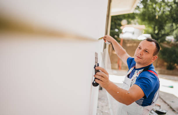 painter measures the wall with a tape measure - home decoration stock pictures, royalty-free photos & images