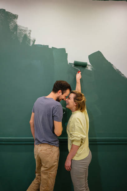 painting the walls of our new apartment - home decoration stock pictures, royalty-free photos & images