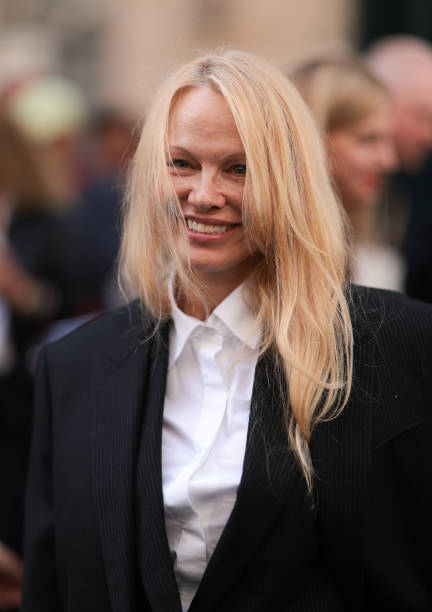 Pamela Anderson is seen outside The Row show wearing a white shirt and black blazer during the Womenswear Spring/Summer 2024 as part of Paris Fashion...