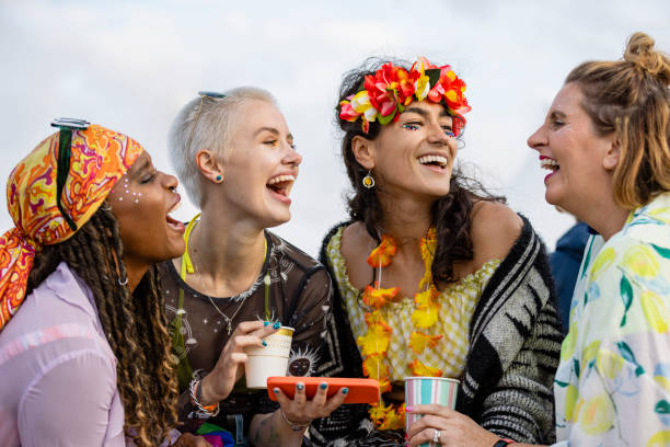 partying outdoors - concert stock pictures, royalty-free photos & images