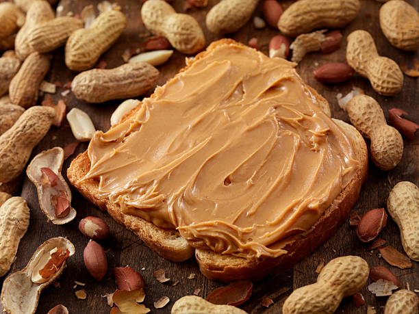 peanut butter on toast - junk food stock pictures, royalty-free photos & images