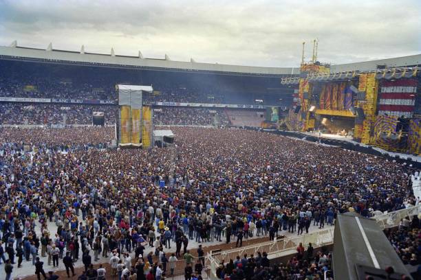 People arrive on June 22, 1990 inside the Parc des Princes in Paris to see the Rolling Stones performing. The Steel Wheels/Urban Jungle Tour has been...