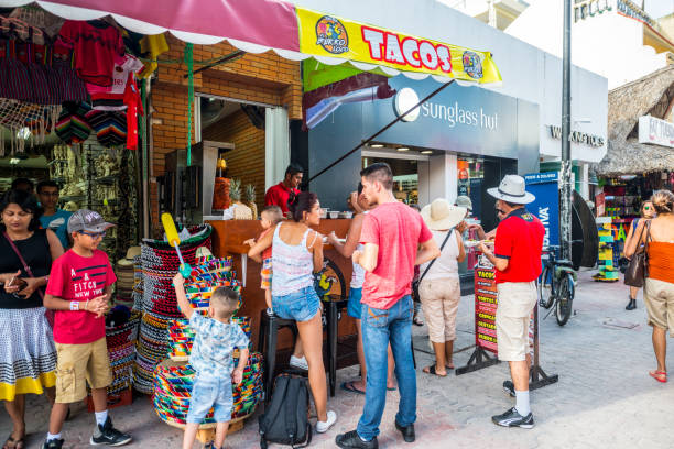 people buying snacks and drinks on 5th avenue, playa del carmen, mexico - junk food stock pictures, royalty-free photos & images