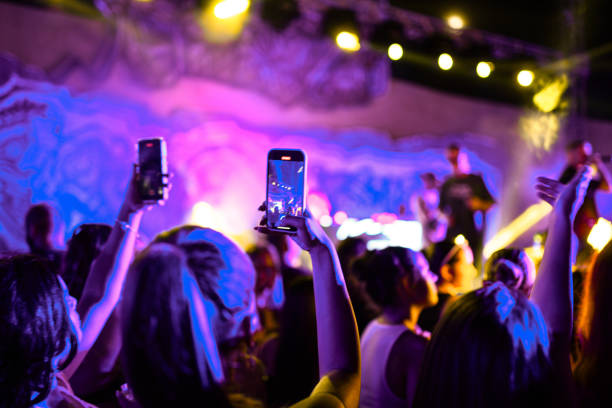 people recording rap group on stage - concert stock pictures, royalty-free photos & images