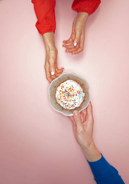 people sharing donut - food stock pictures, royalty-free photos & images