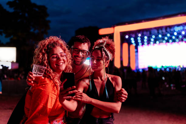 people take selfie at music festival - concert stock pictures, royalty-free photos & images