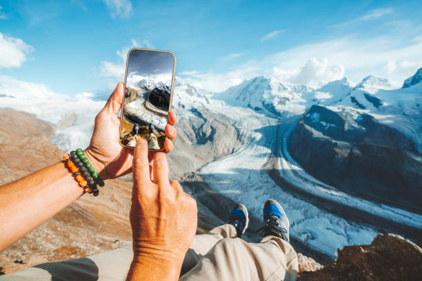personal perspective of person photographing gorner glacier with smartphone, switzerland - travel stock pictures, royalty-free photos & images