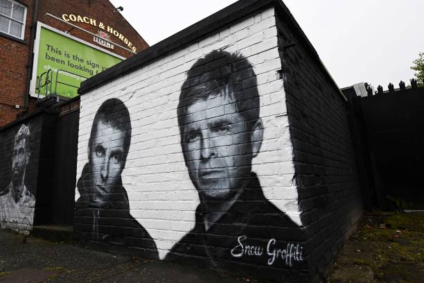 Photograph taken on September 2, 2024 shows a mural created by artist Scott Wilcock aka Snow Graffiti, depicting Liam Gallagher and Noel Gallagher...