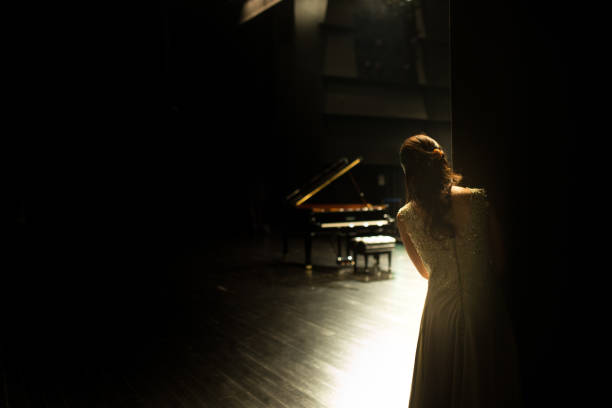 pianist wating for starting her concert - concert stock pictures, royalty-free photos & images