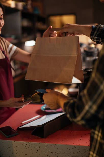 picking up food from a restaurant - junk food stock pictures, royalty-free photos & images