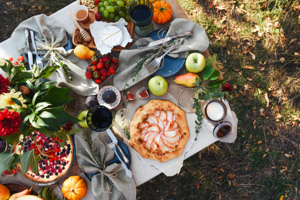 picnic in nature in the autumn season. festive table setting. delicious and fresh food. rest at nature. autumn holiday. boho style. lifestyle. - food stock pictures, royalty-free photos & images