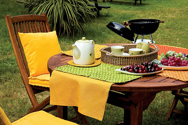 picnic table and barbecue on garden - garden decoration stock pictures, royalty-free photos & images