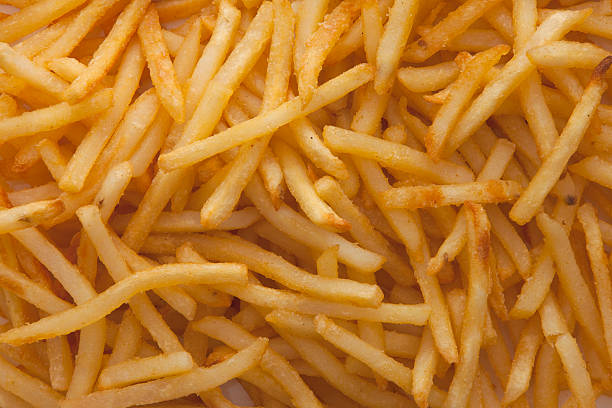 pile of french fries - junk food stock pictures, royalty-free photos & images