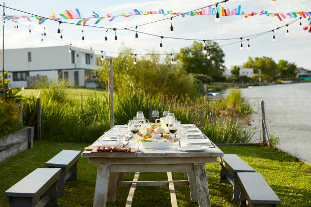 place setting on table during asado party in yard - garden decoration stock pictures, royalty-free photos & images