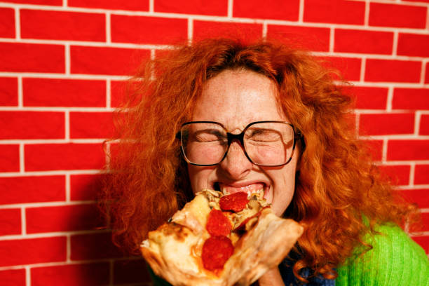 playful pizza moment - junk food stock pictures, royalty-free photos & images
