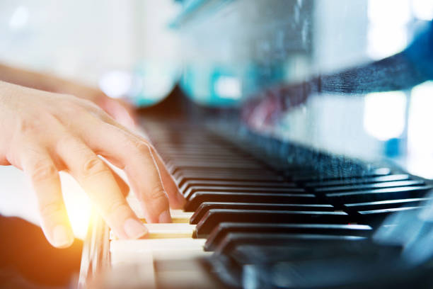 playing a piano - concert stock pictures, royalty-free photos & images